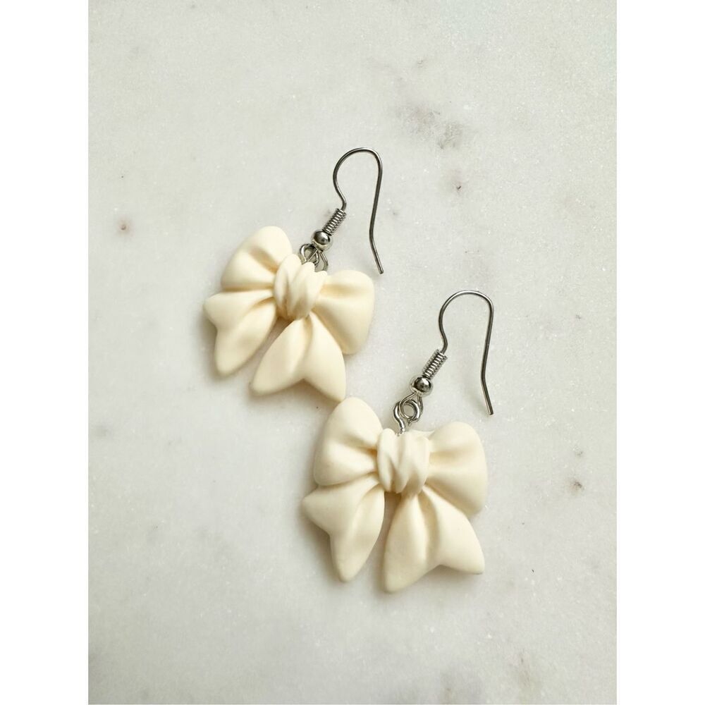 Cream cute bow dangle earrings